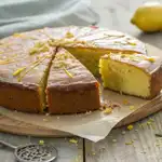 Vegan Lemon Olive Oil Cake: A Delicious Twist on Healthy Baking 2 Vegan lemon olive oil cake sliced on table