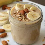 The Ultimate Guide to Making the Perfect Gluten-Free Banana Nut Smoothie 2 Gluten-free banana nut smoothie with almonds and banana slices