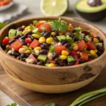 Easy cowboy caviar recipe in wooden bowl with colorful beans and vegetables