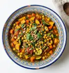 Mediterranean Vegetable Tagine (45 Minutes, Serves 6) 1 Overhead view of Mediterranean Vegetable Tagine with chickpeas and spiced vegetables for recipe card