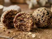 Tahini Date Energy Balls (Makes 18-20, No Bake) 1 Tahini date energy ball cut in half showing texture